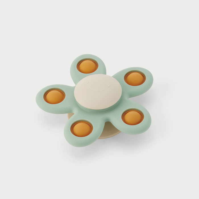 Spinner blóm á glugga
